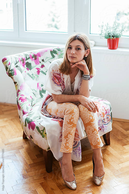 Young beautiful woman in floral pattern clothes