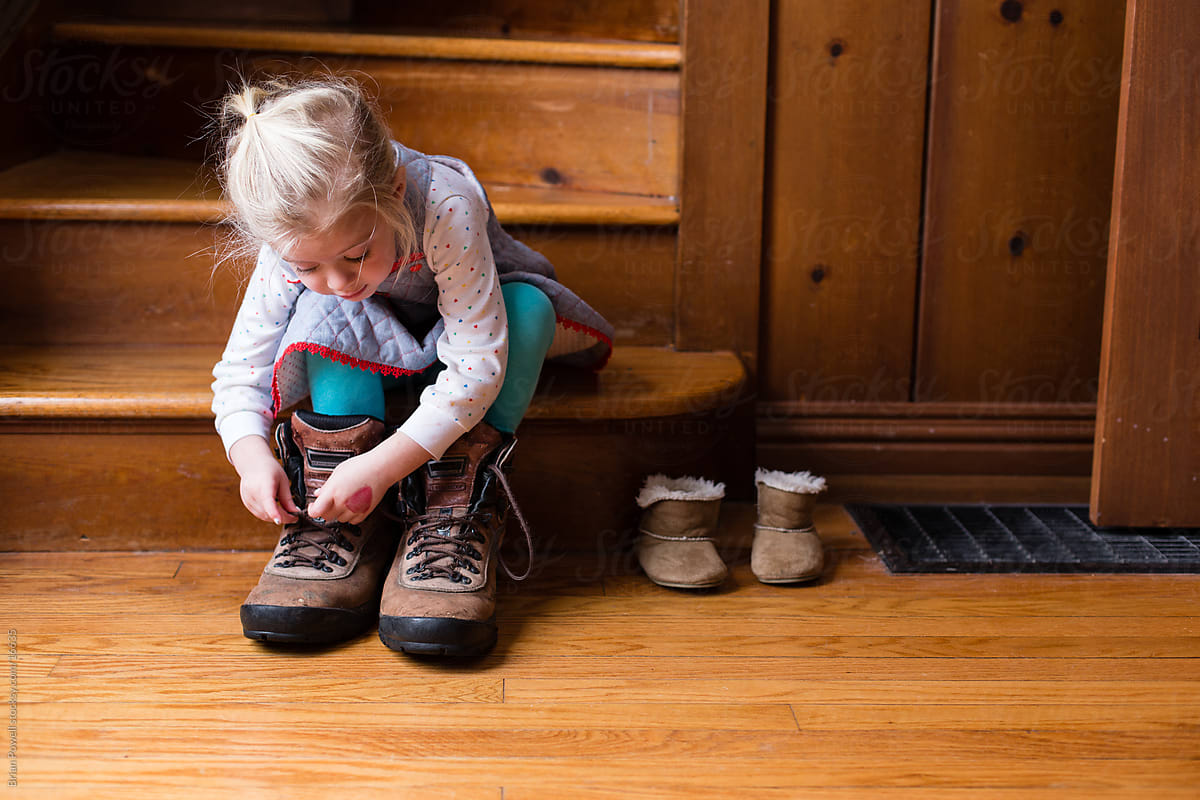 little girl wearing shoes