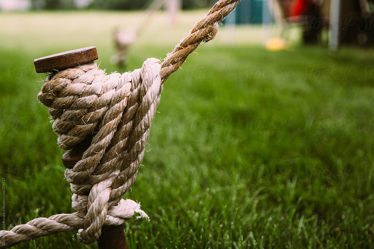 Jute Rope Fastened to a Peg to Hold a Tent at an Outdoor Festival