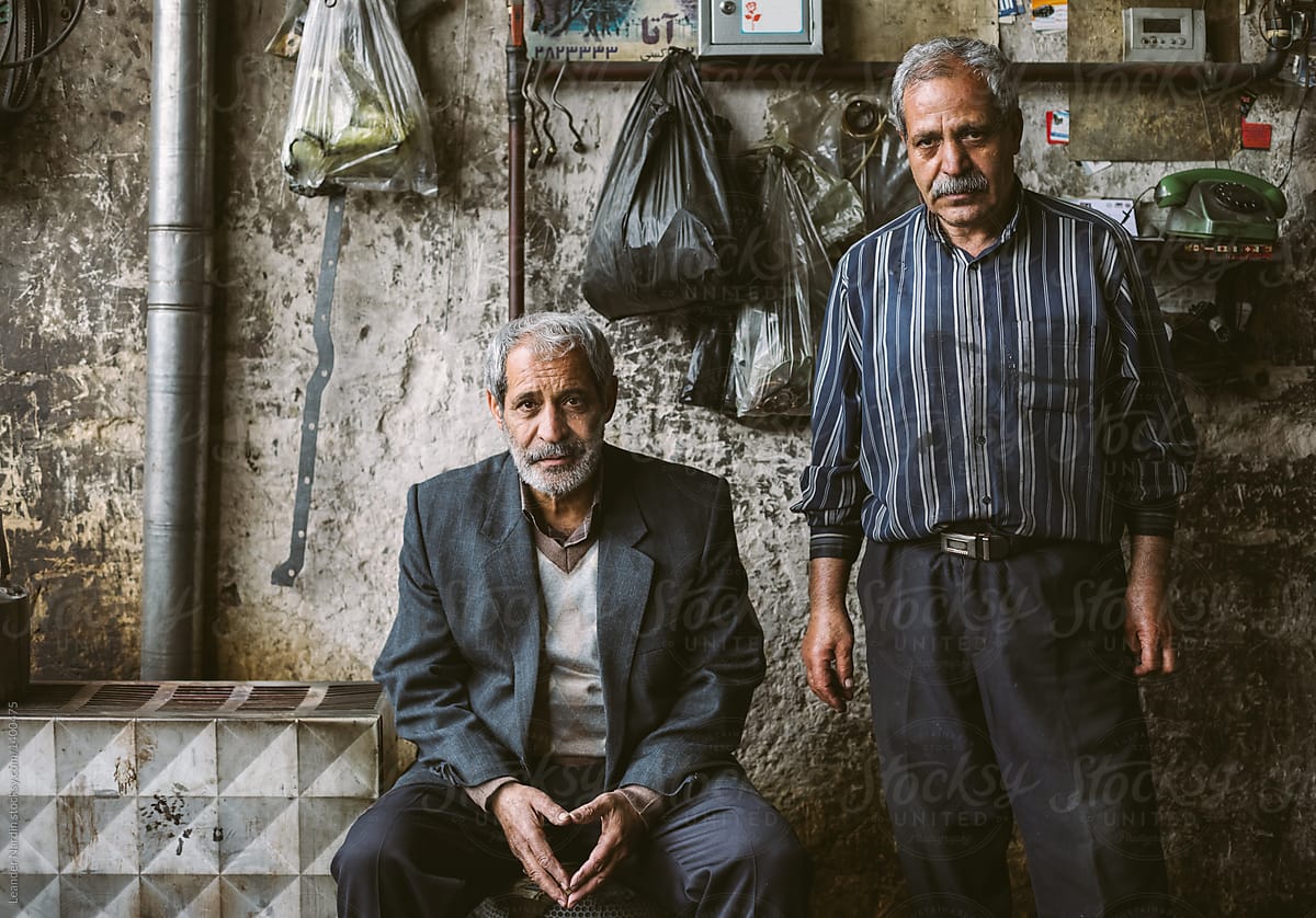 two male iranian seniors in their garage