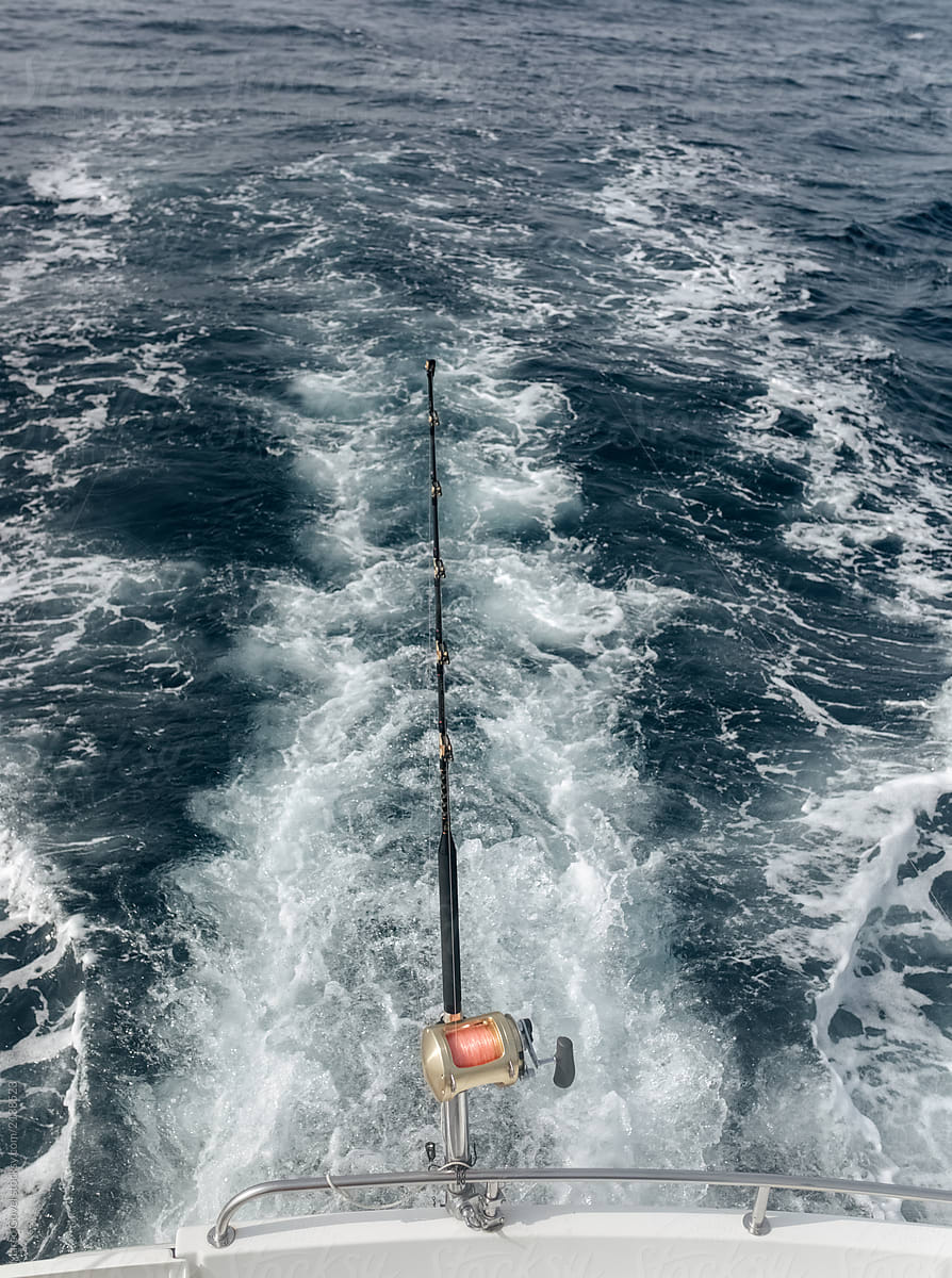 Fishing Rods On A Fishing Boat by Stocksy Contributor Marco Govel