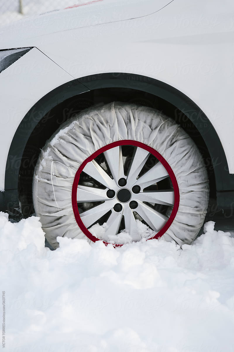 Textile snow chain on a car tire