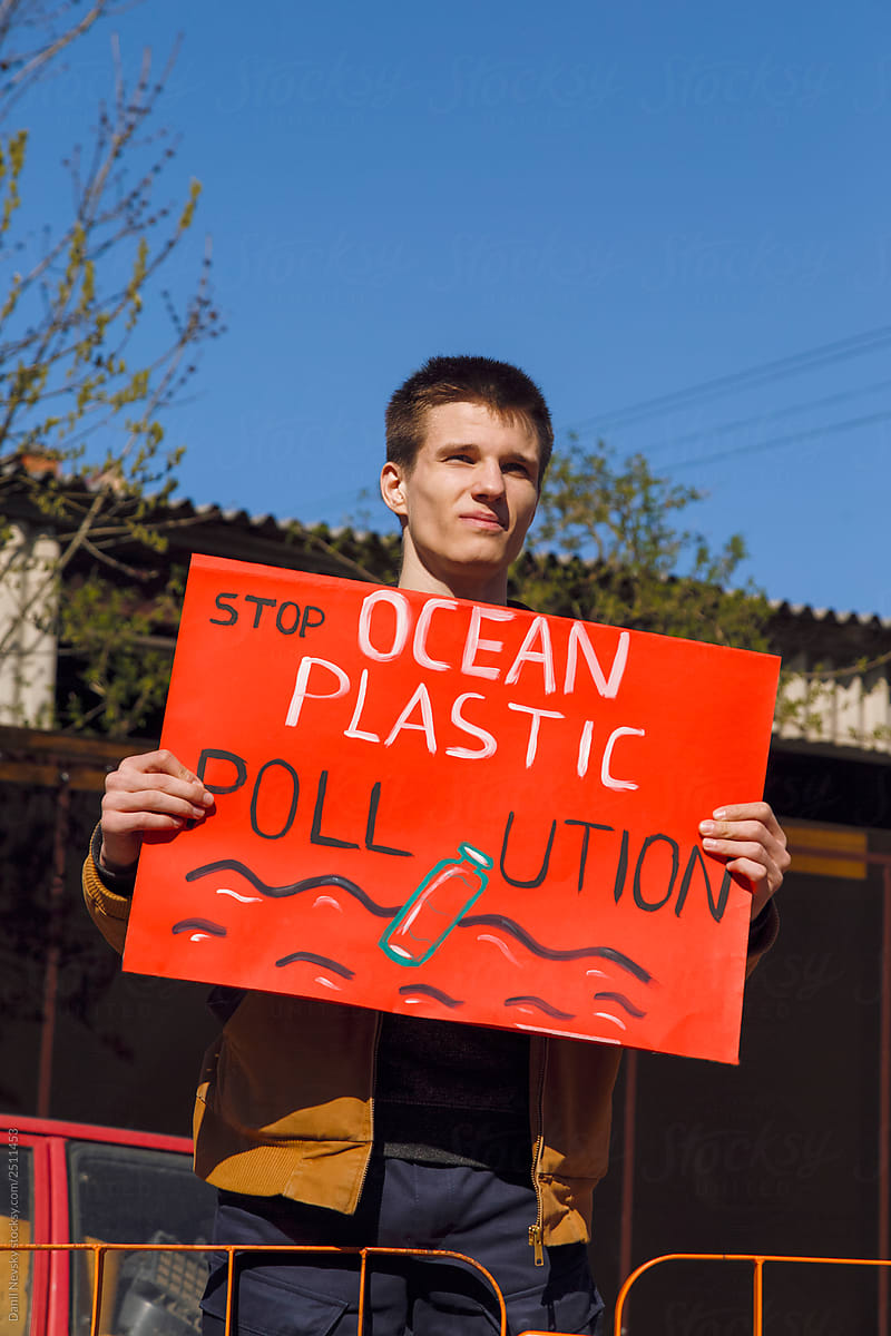 Man with poster of environmental protection