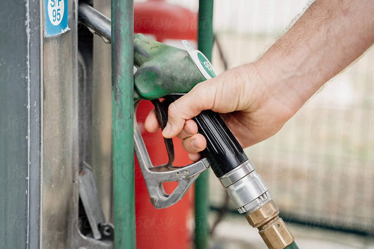 Close-up of Man refilling the fuel  tank in gas station