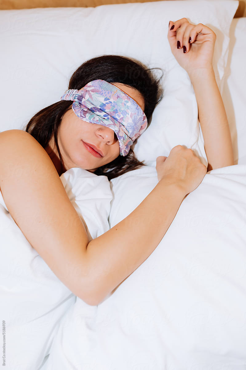 A woman With a Sleep Mask Wakes Up