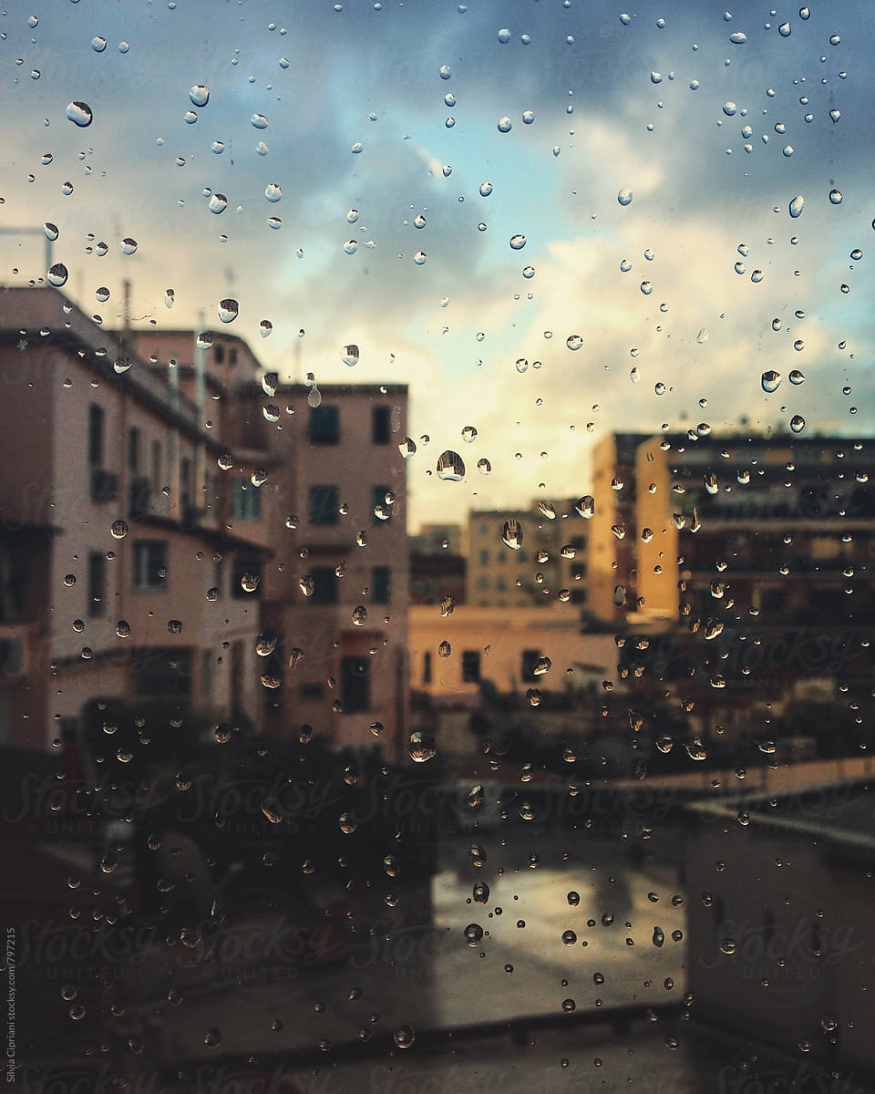 Raindrops on the window in a rainy day in Rome