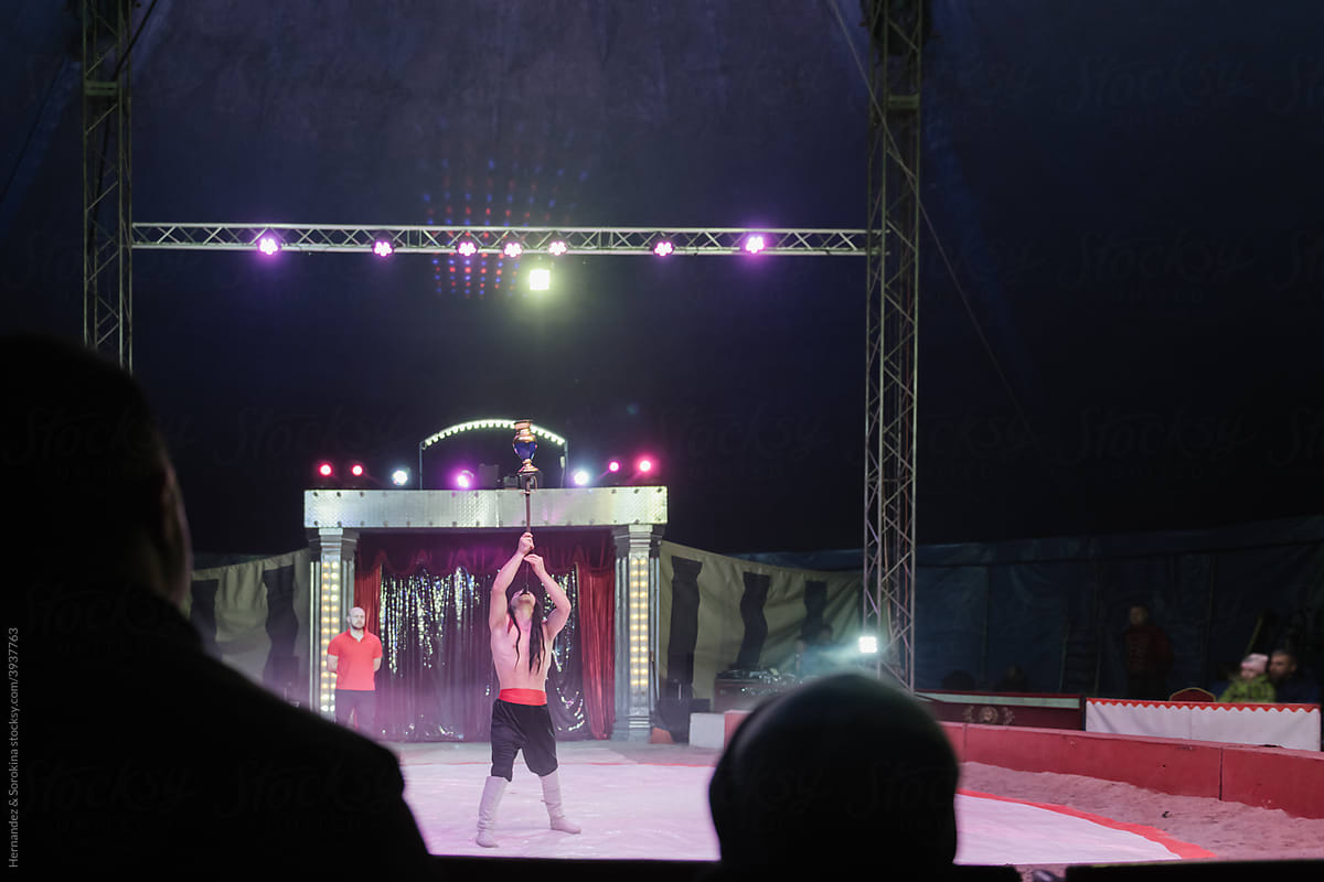 Circus Artists Performing On Arena