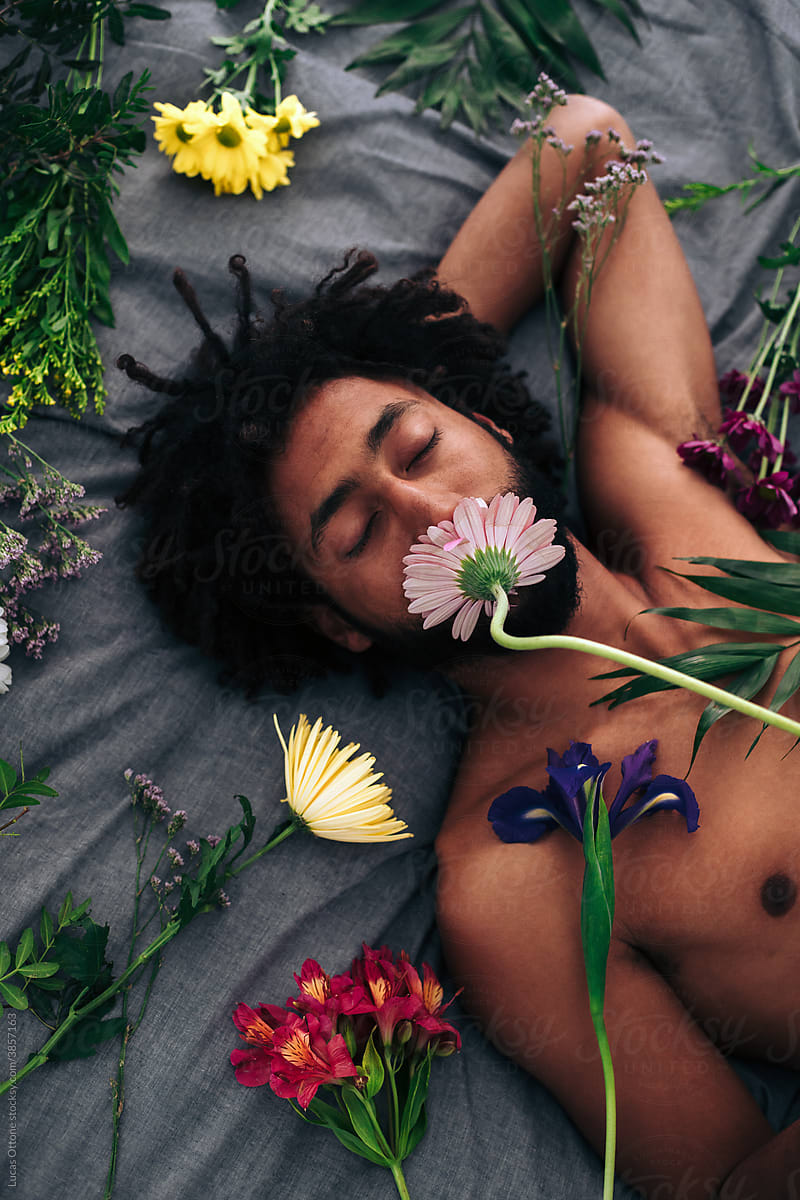 Man surrounded by flowers