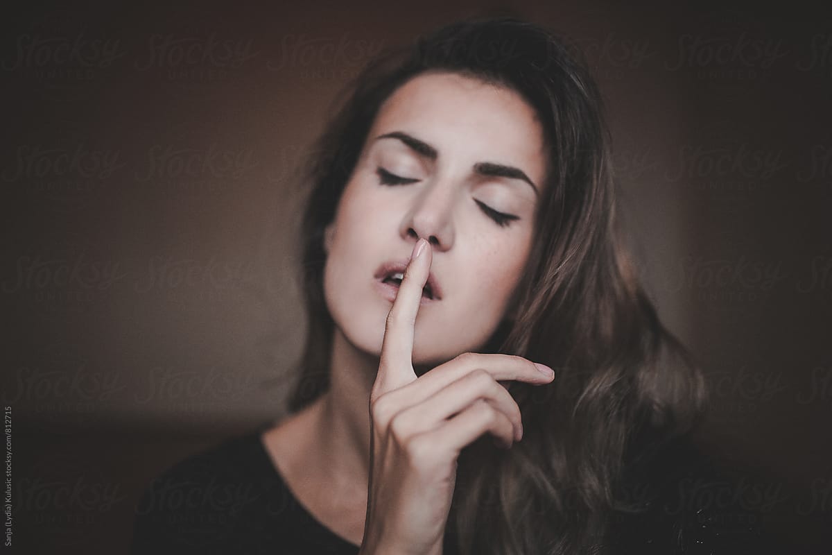 Girl With Closed Eyes Making Shhh Sign With Focus On Her Hand By Sanja