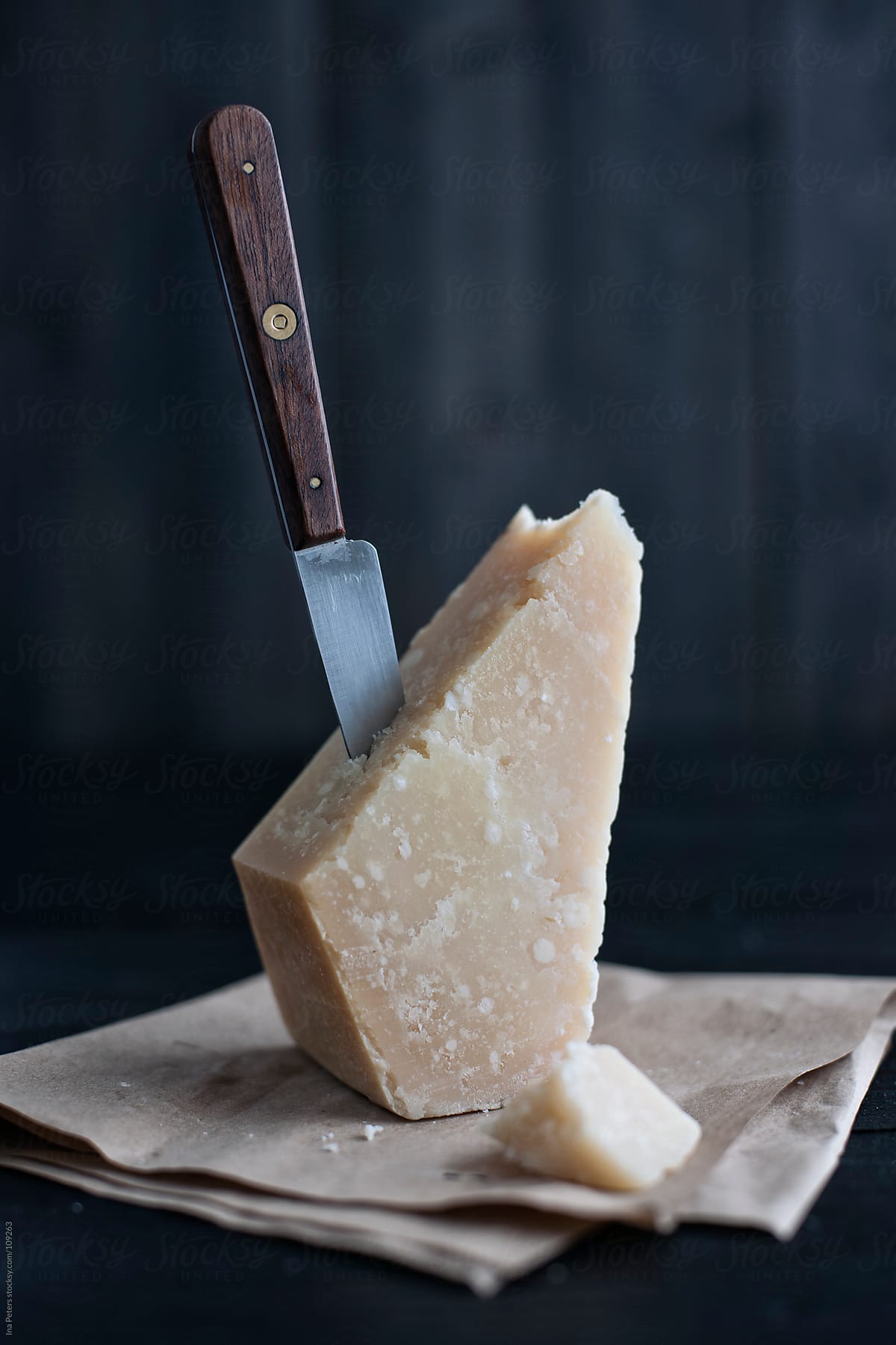 Food: Grana Padano, italian cheese with knife