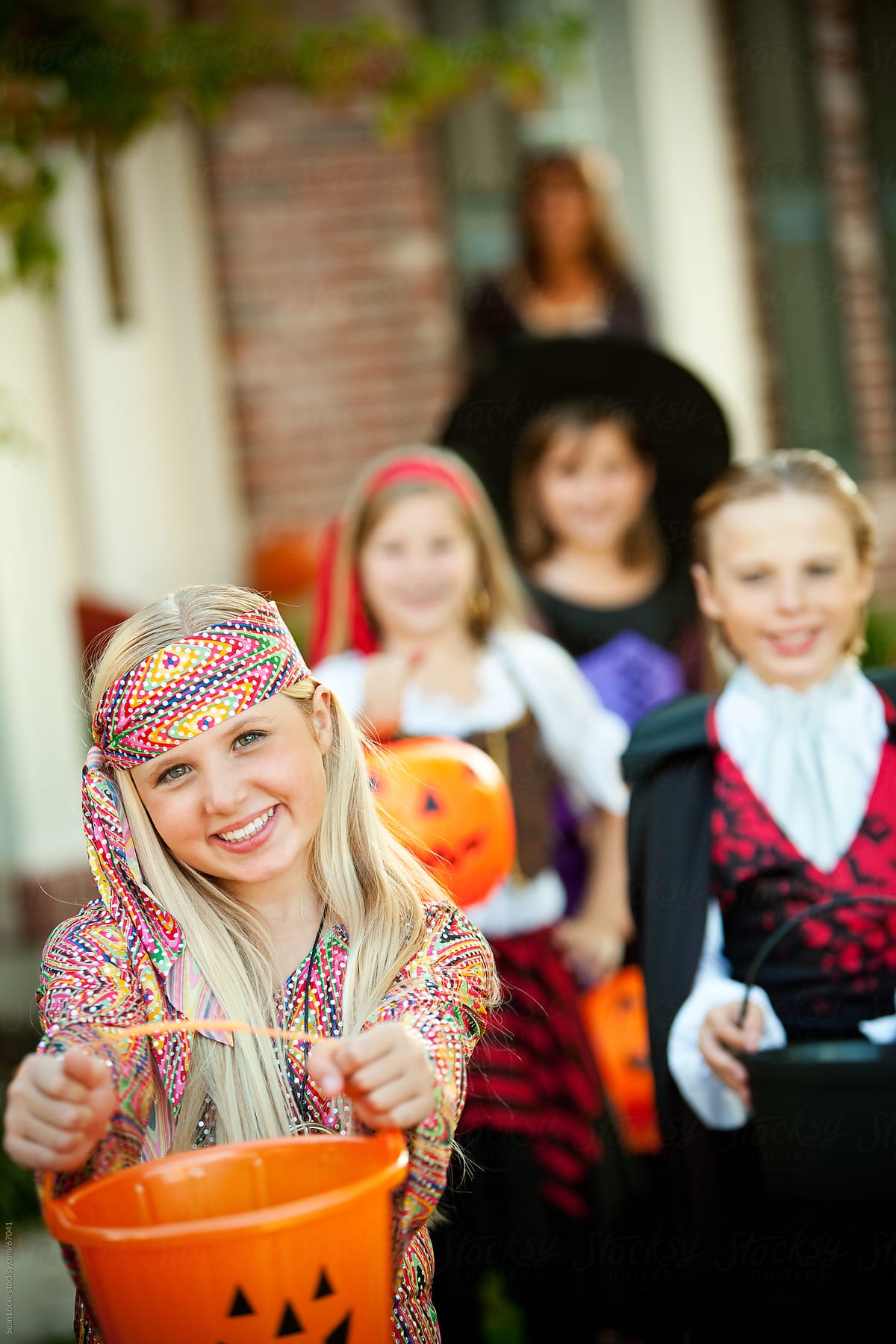 Halloween: Little Girl Holds Out Halloween Bucket