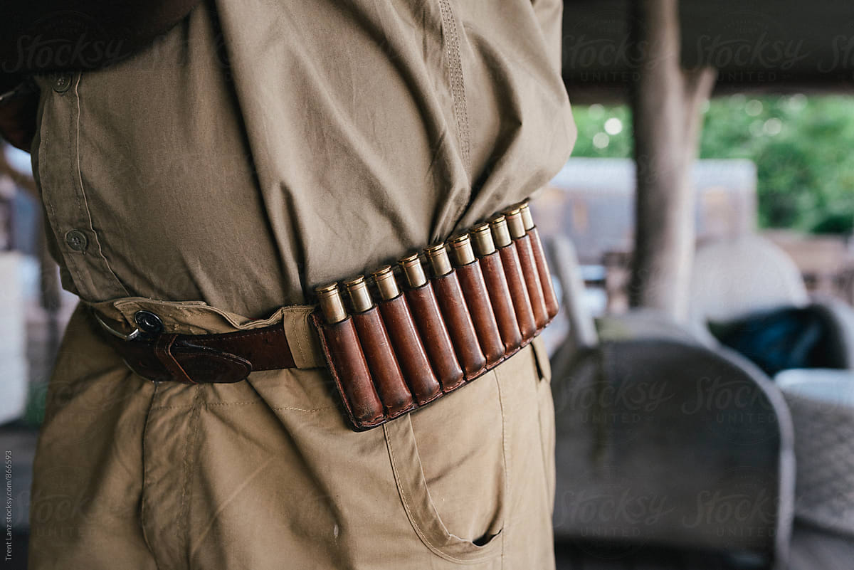 Close-up of safari man wearing belt with bullet cartridges