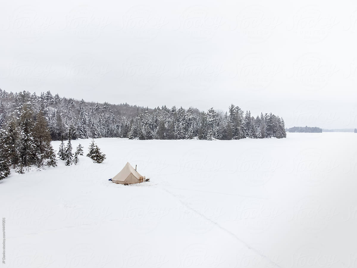 Remote Winter Tent Campsite with Snowshoes