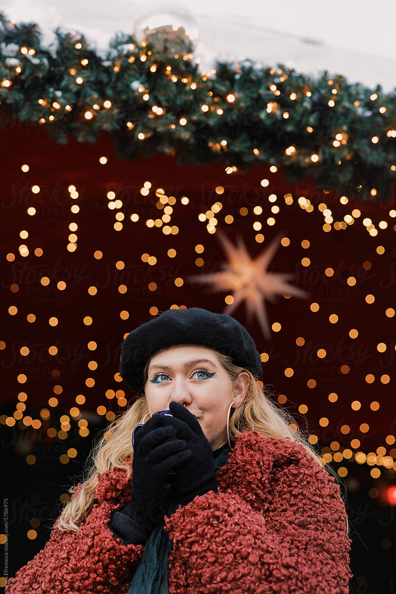 Winter Sip: Blond Woman and Mulled Wine Glow