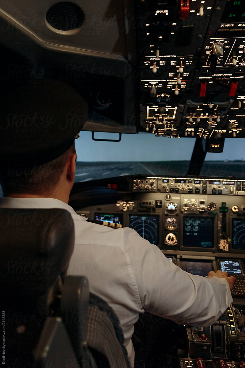 Pilot of aircraft at work in cockpit