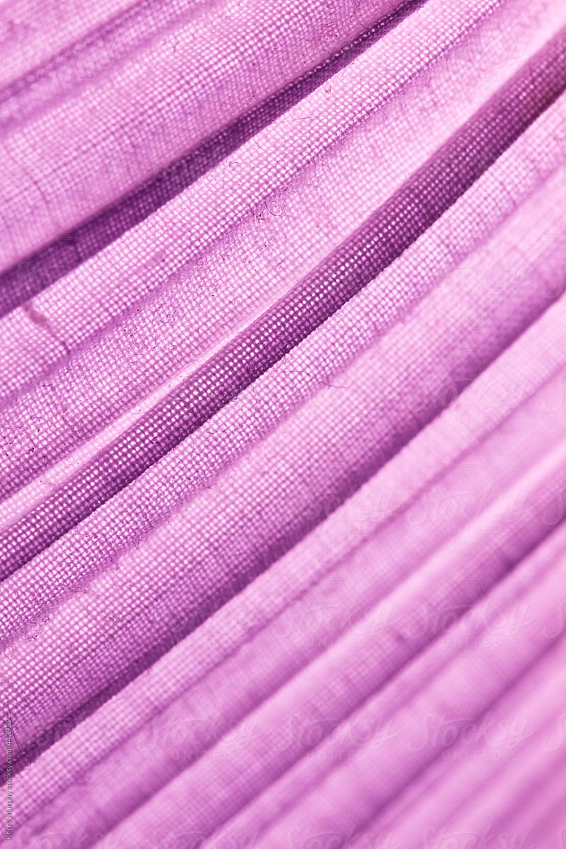 Abstract of lines on purple fabric