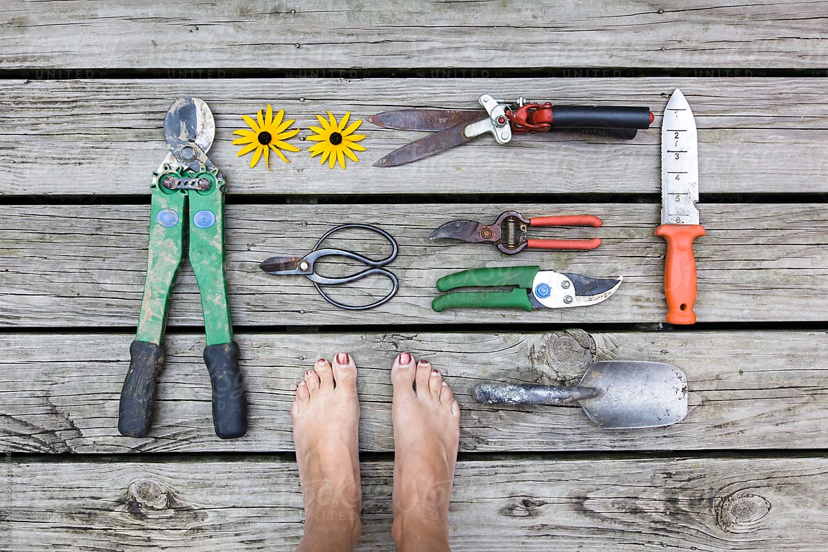 Women S Feet With Garden Tools On Wooden Deck By Stocksy Contributor Holly Clark Stocksy