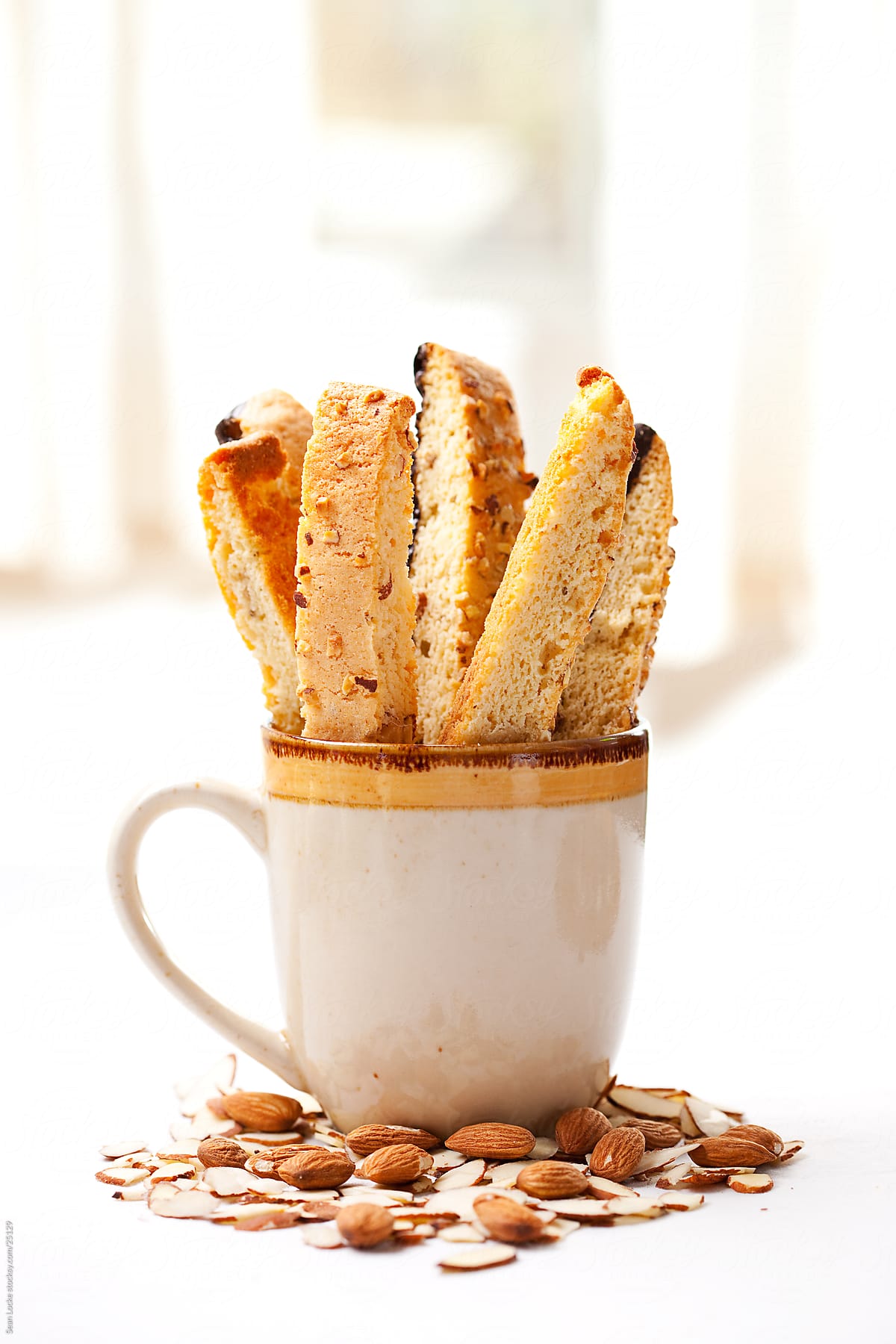 Biscotti: Coffee Mug Filled With Biscotti" by Stocksy Contributor "Sean  Locke" - Stocksy