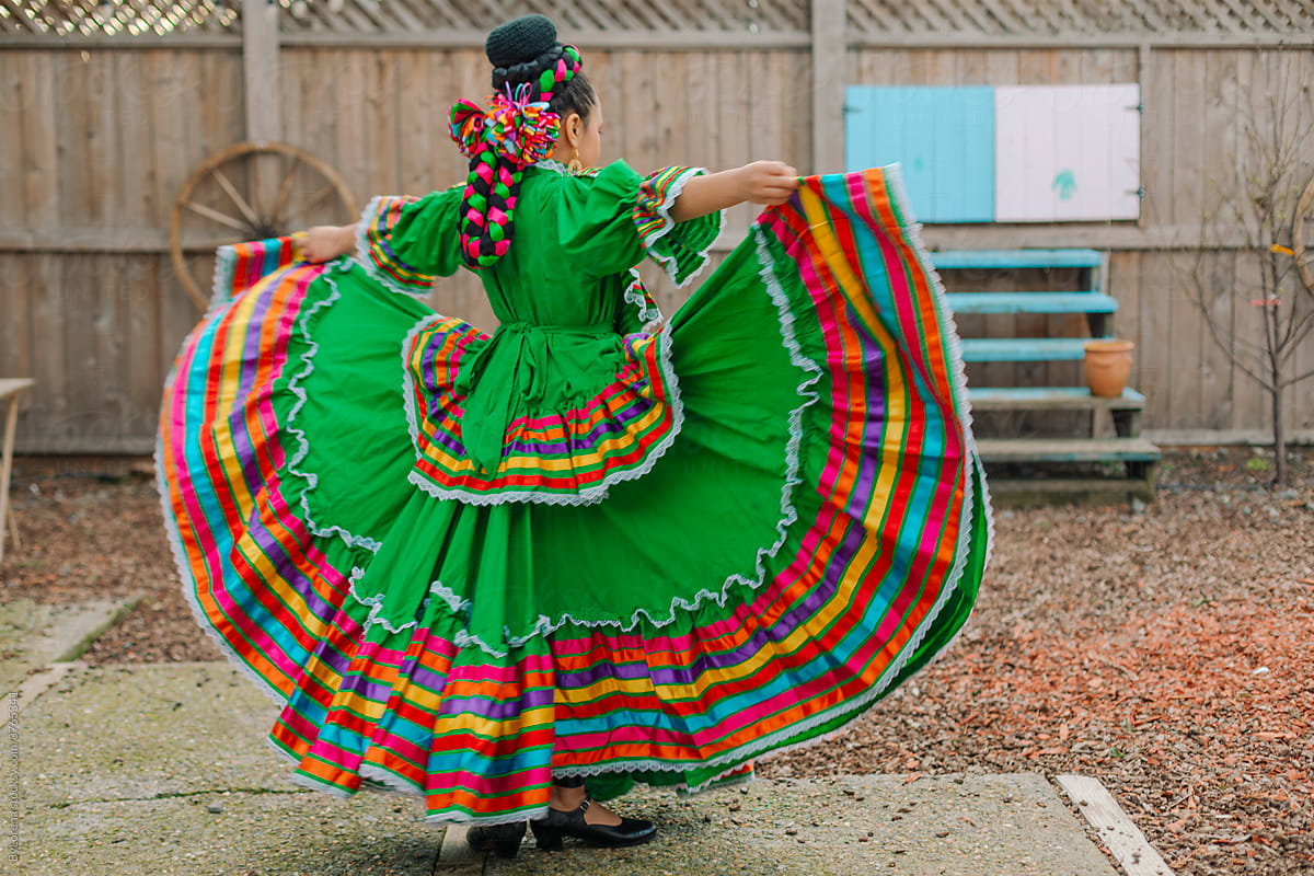Mexican-American tween wearing a traditional dress