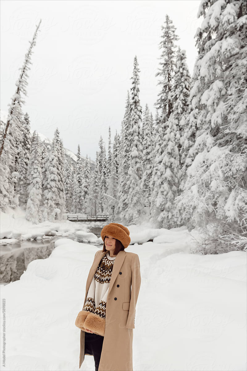 Photos of a stylish winter outfit in the snowy mountains