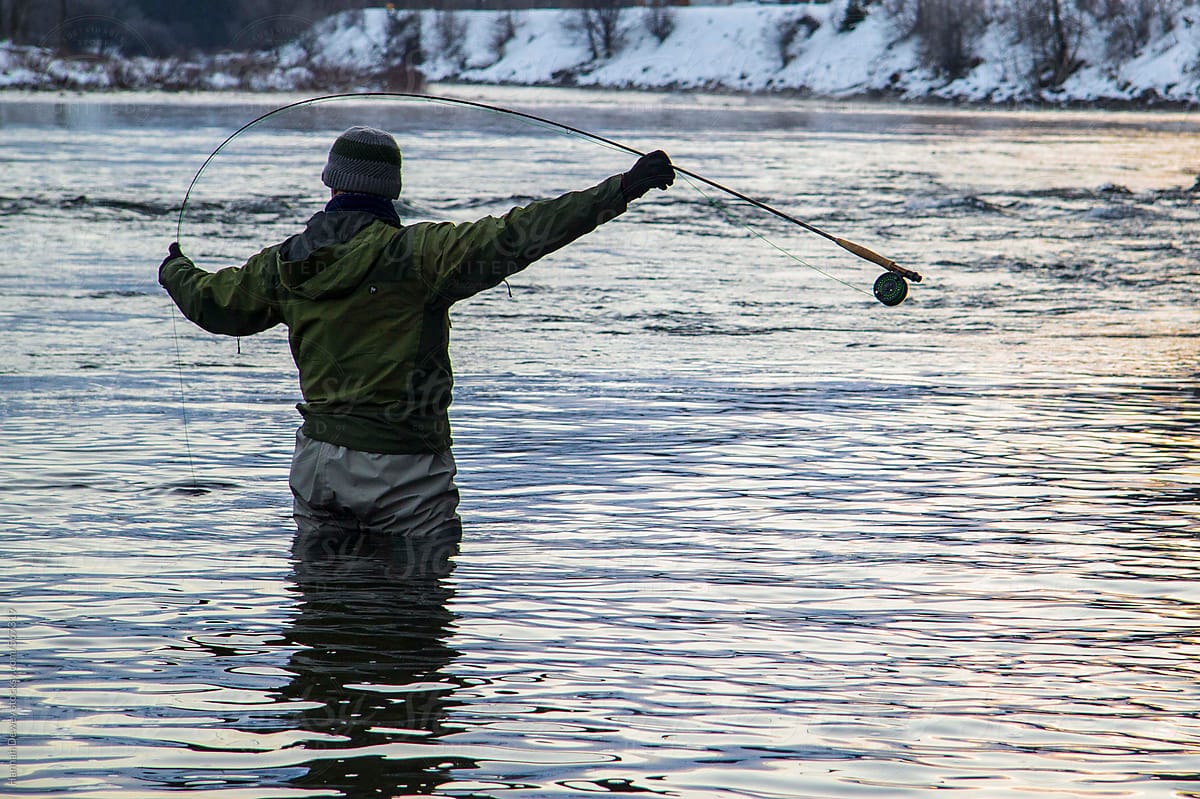 Man De-ices His Fly-fishing Rod On The Twisp River, WA During Winter by  Stocksy Contributor Hannah Dewey - Stocksy