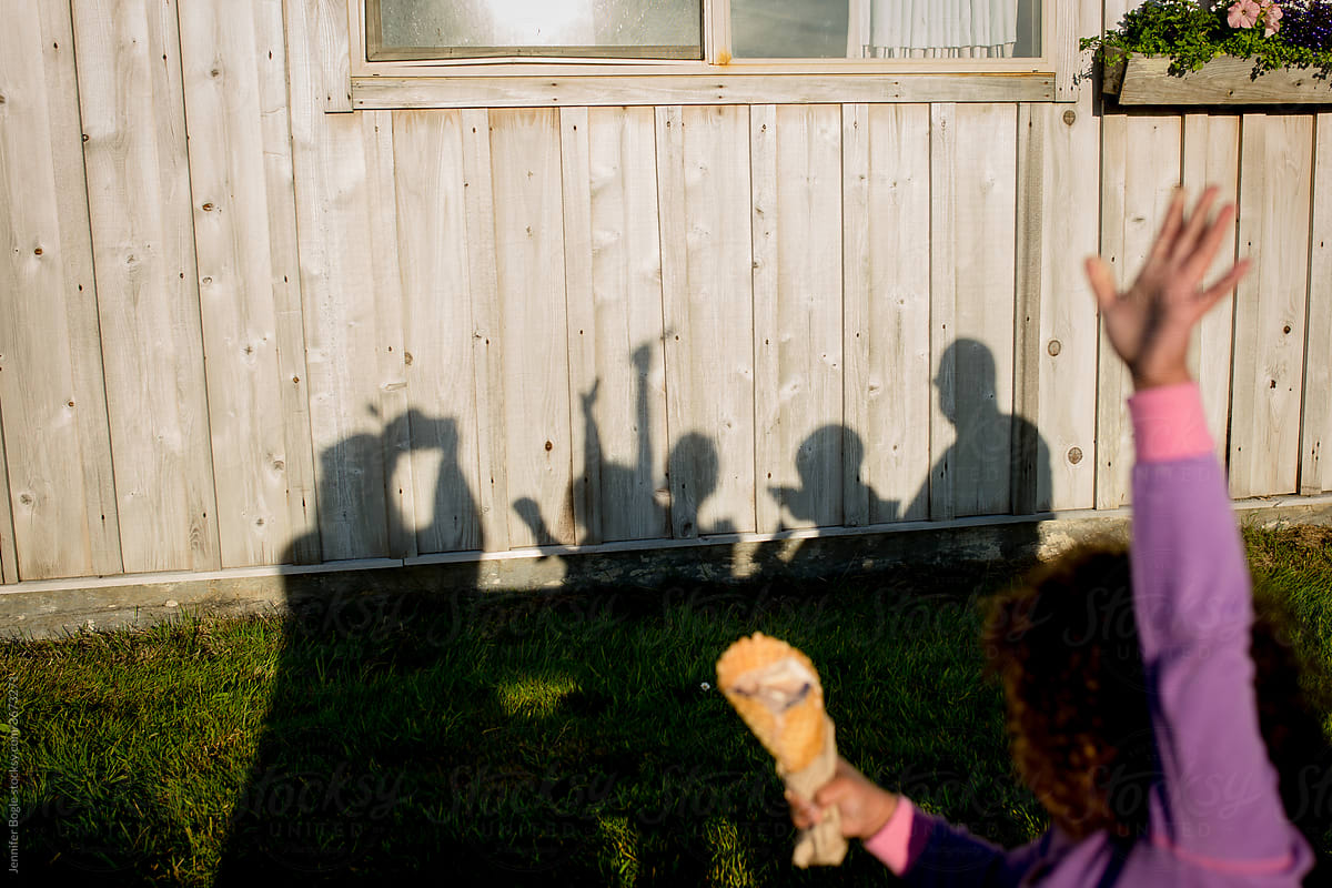 shadow portrait of family on wooden cabin
