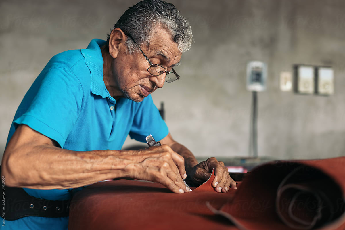 Older artisan shoemaker working