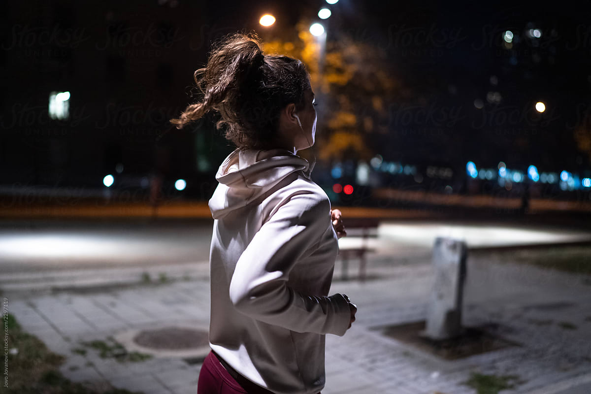 Woman running alone at night