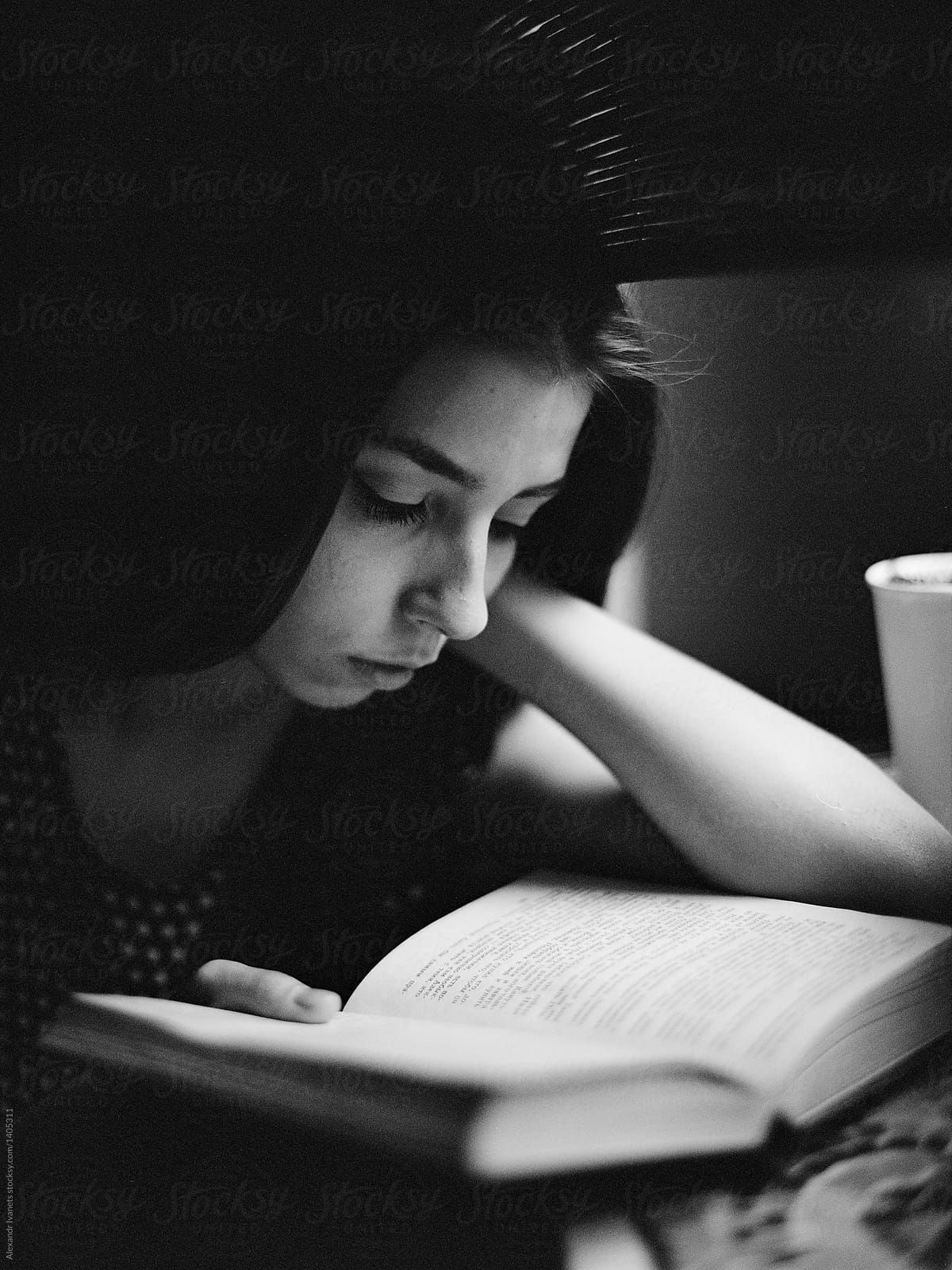 Concentrated woman reading book