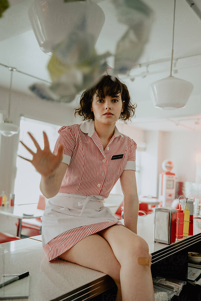 1950s Diner Waitress Sitting on Countertop
