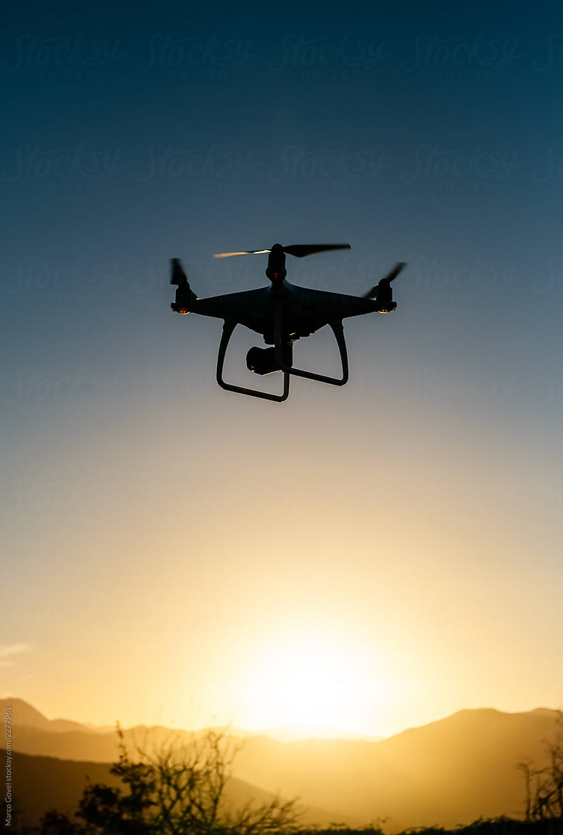 Drone starting the flight at sunset