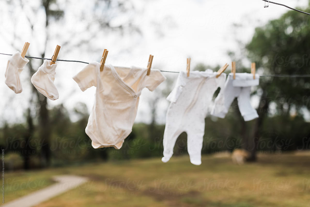 newborn baby clothes on clothes line
