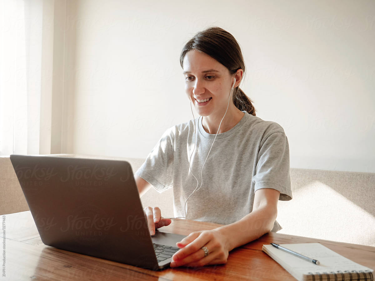 Woman with laptop doing homework online study