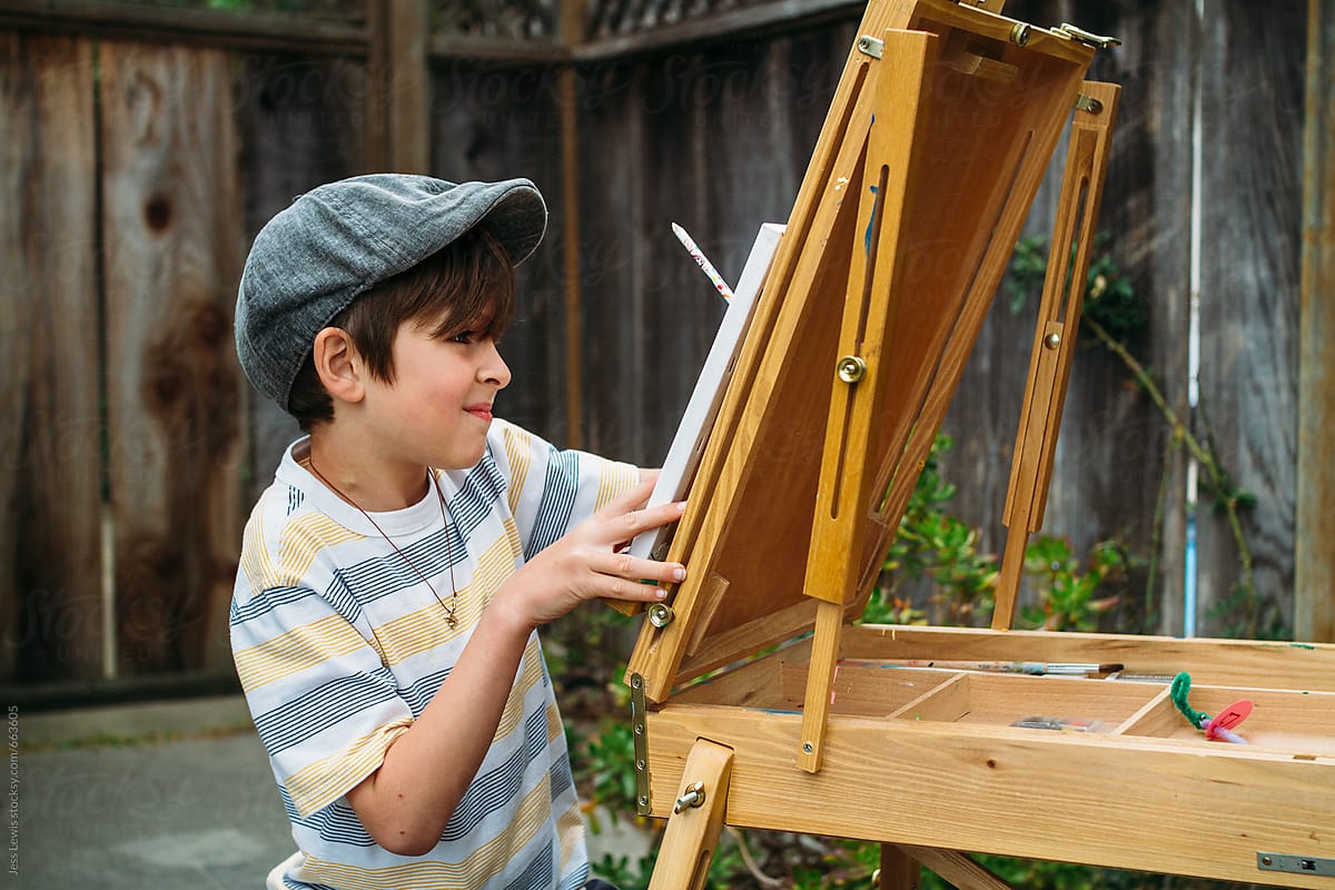 boy drawing at an easel