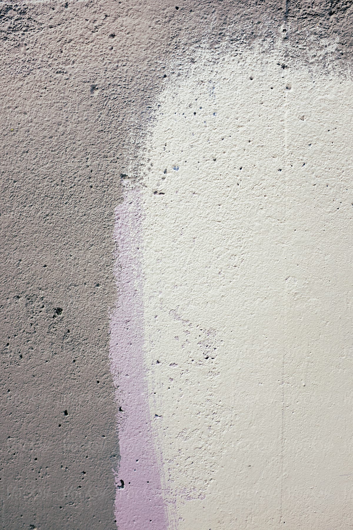 Paint covering graffiti on building wall, close up