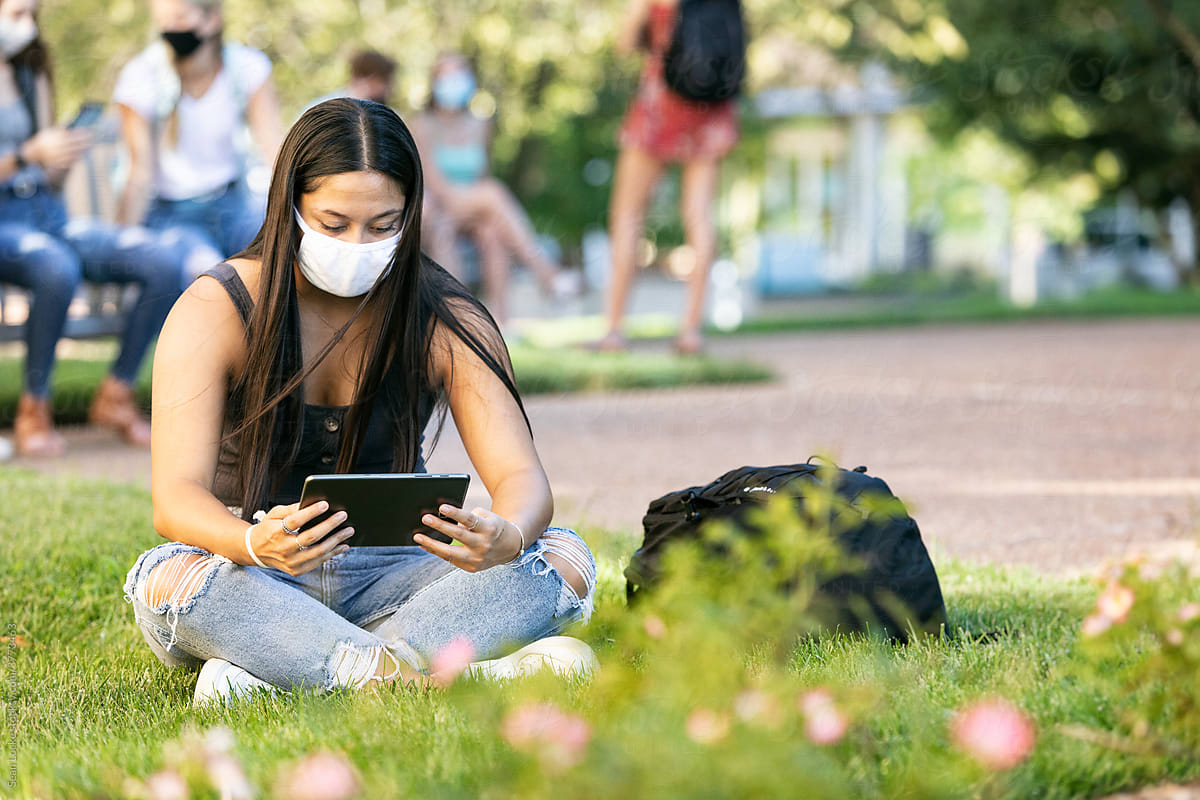 Covid: College Student Doing Remote Class Outside With Digital T