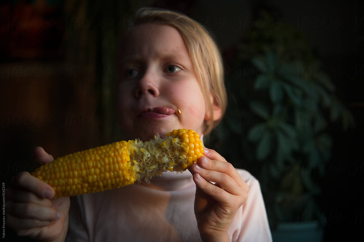 funny girl eating corn