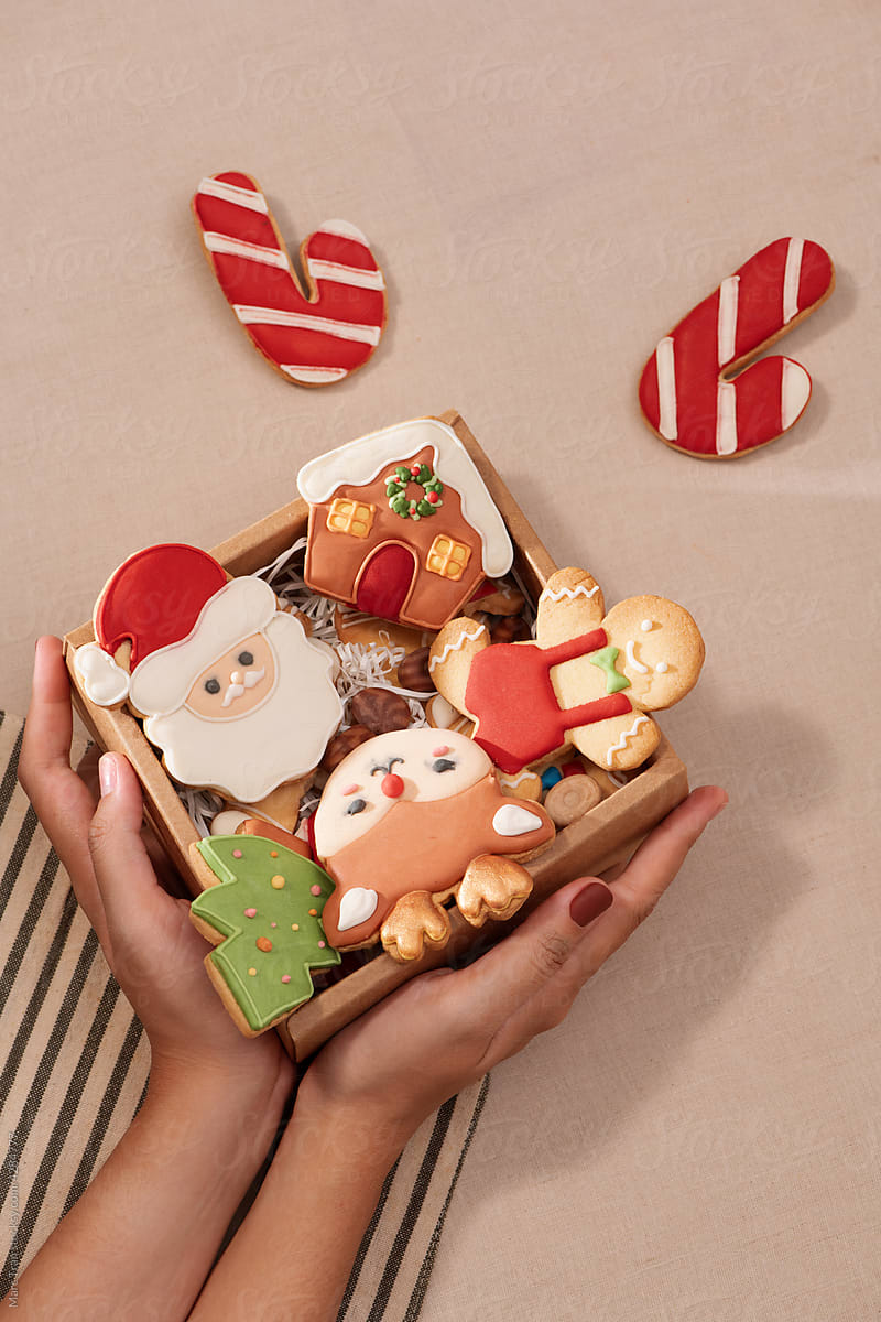 a gift box full of gingerbread cookies
