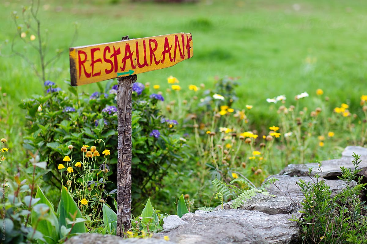 Handmade restaurant sign outside a rural restaurant