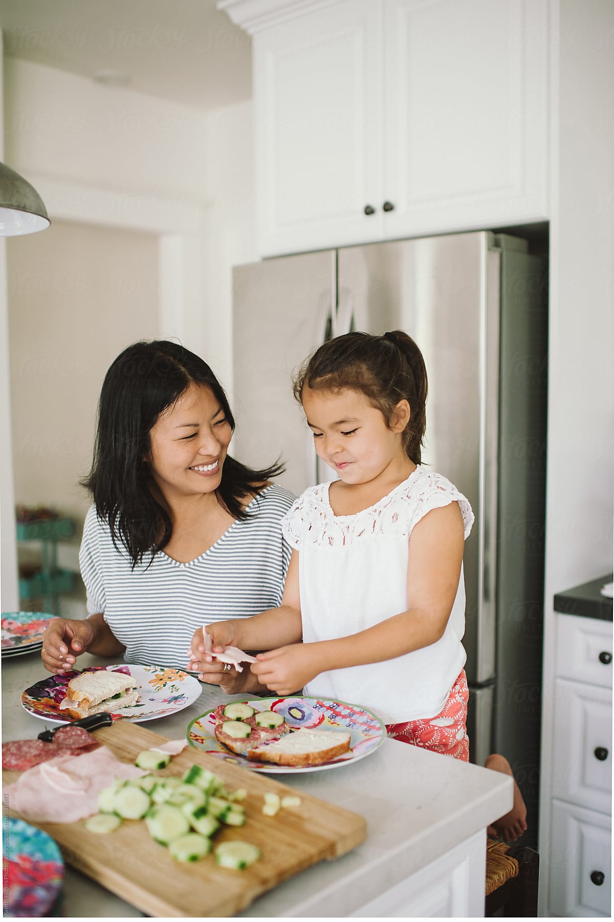 Mom And Daughter Making Lunch Together In Kitchen By Stocksy