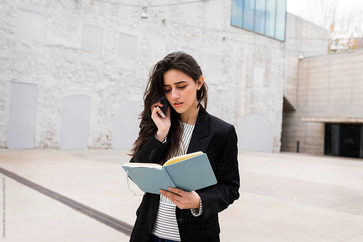 Businesswoman working outside building