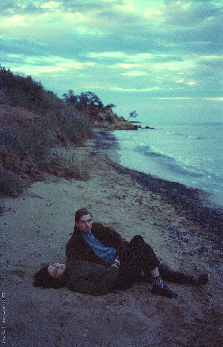Young couple lying on the beach