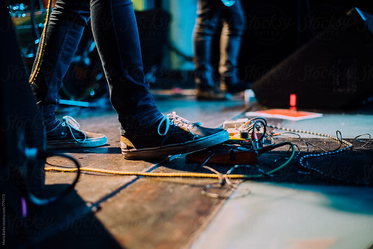 Stepping on the guitar pedal in a rock music show