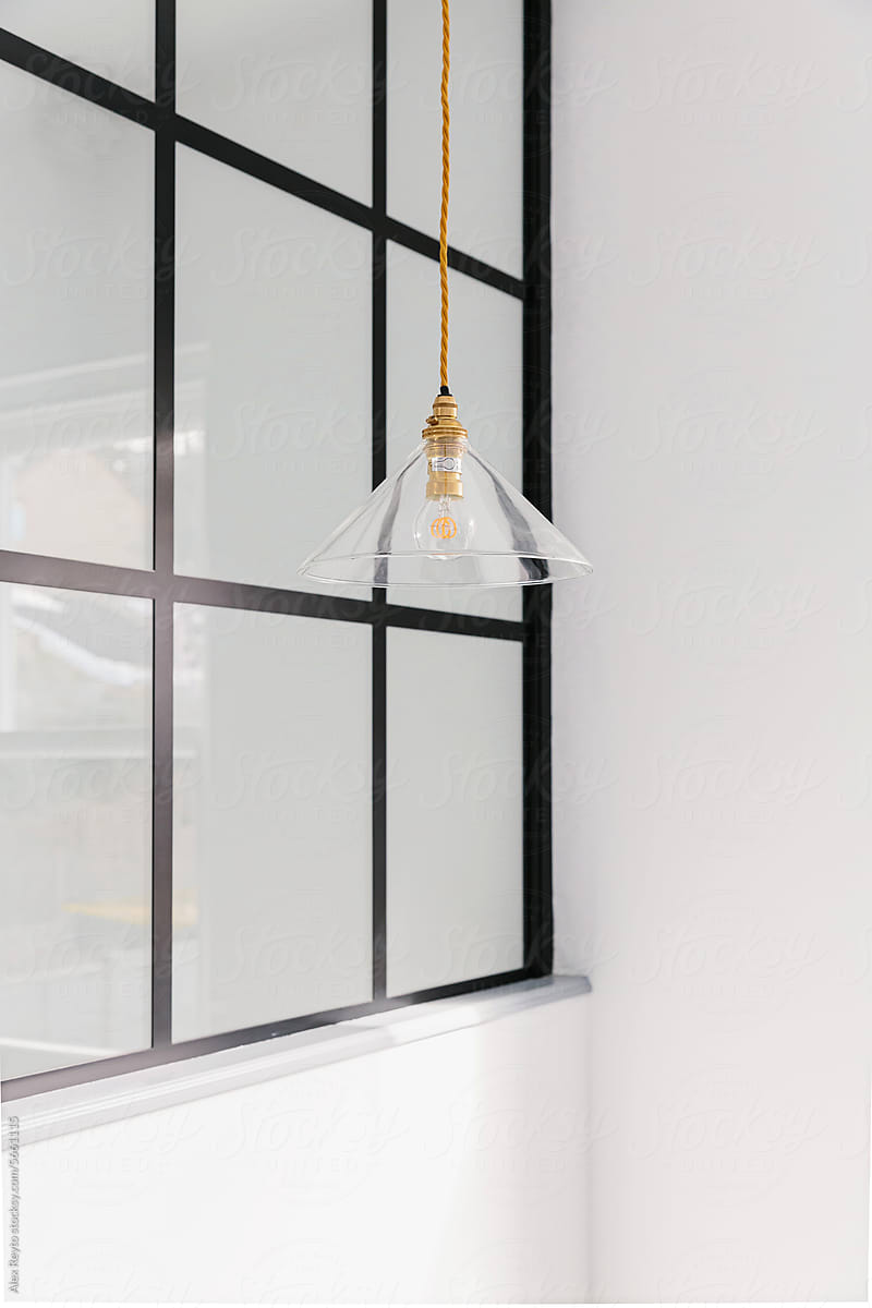 Hanging glass light fixture in a London home.