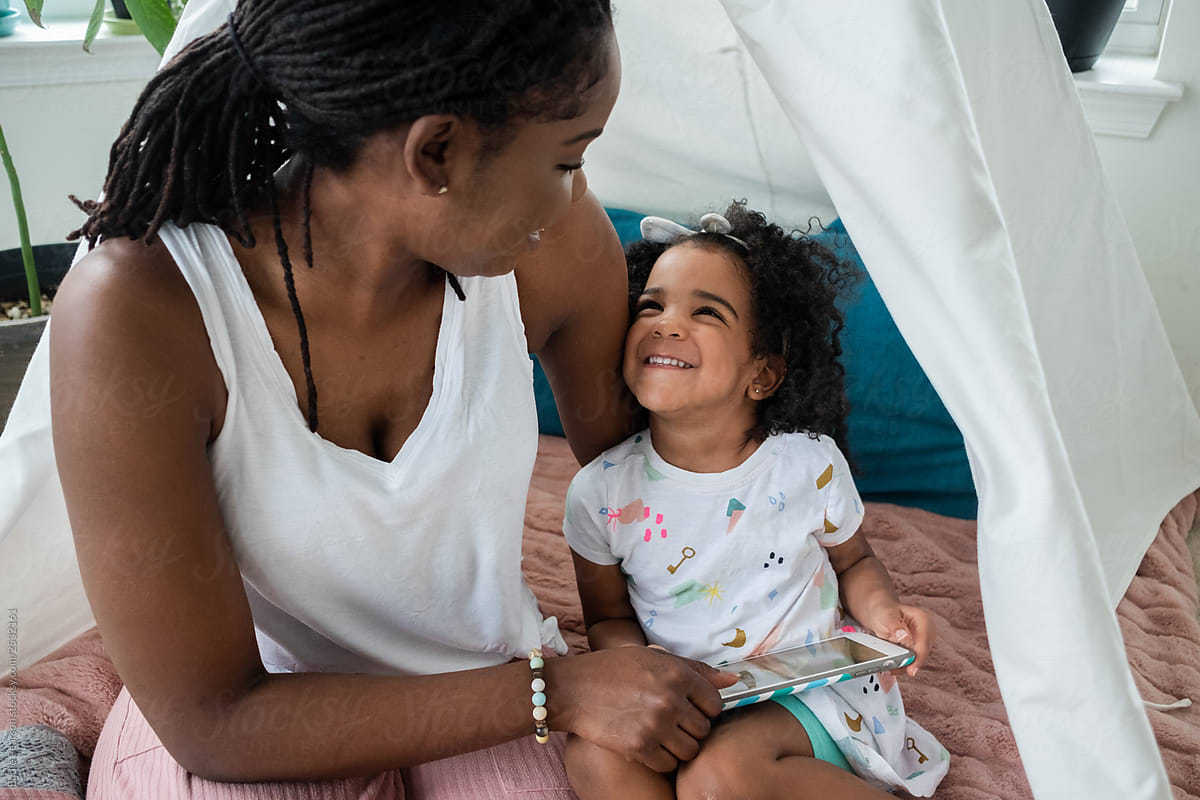 Mother and daughter in a tent