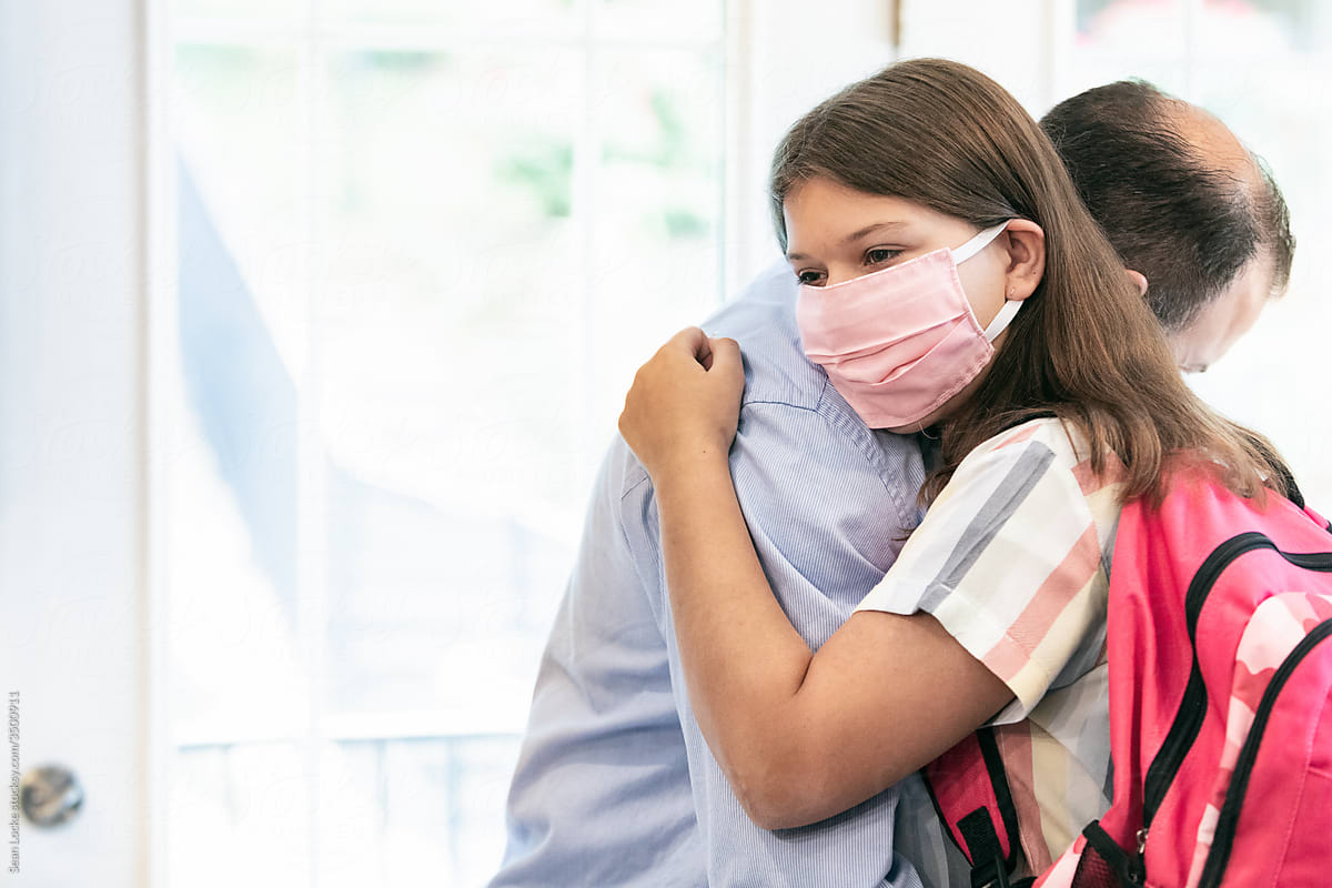 Morning: Father And Daughter With Face Mask Hug Before First Day