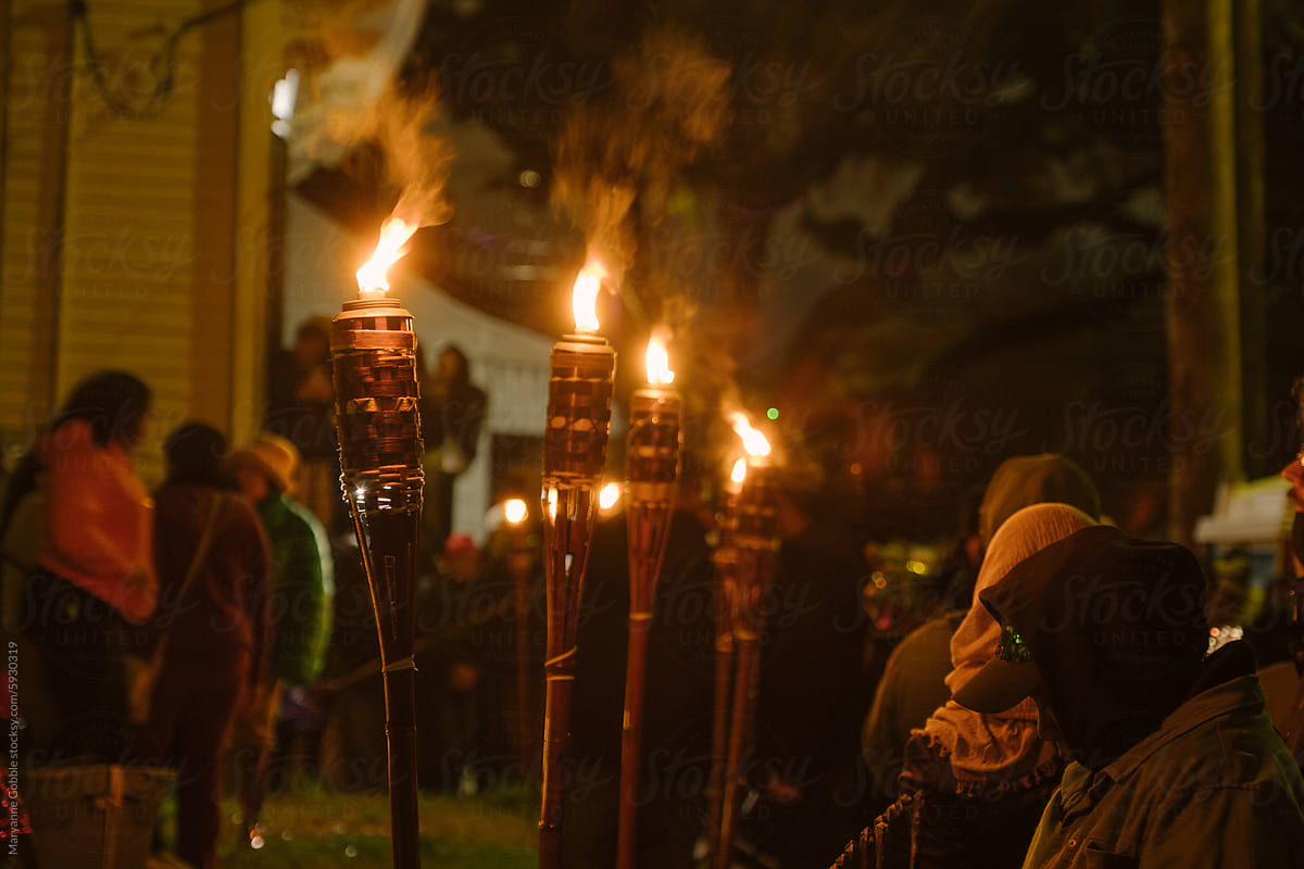 New Orleans Mardi Gras Celebration with Torches at Night