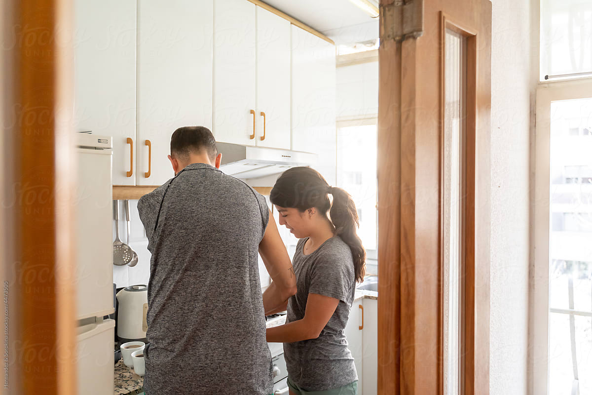 Couple In The Home Kitchen