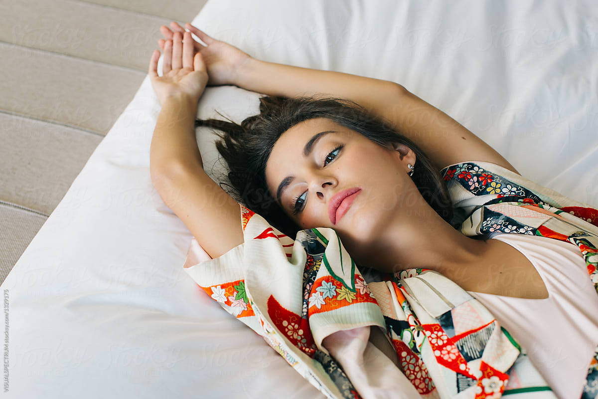 Overhead Closeup Of Beautiful Brunette In Japanese Kimono Lying On Bed 3468