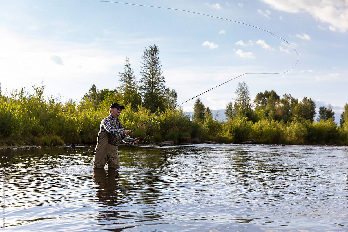 Middle age man Fly Fishing Provo River Utah in United States